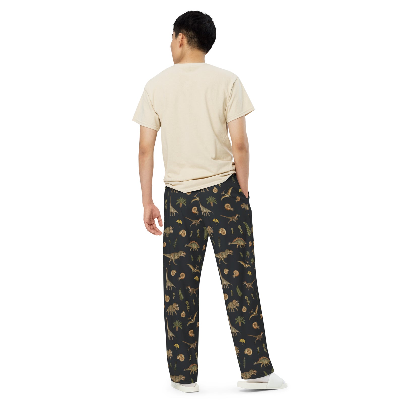 Model wearing Museum Dinosaurs adult dinosaur pajama pants, back view