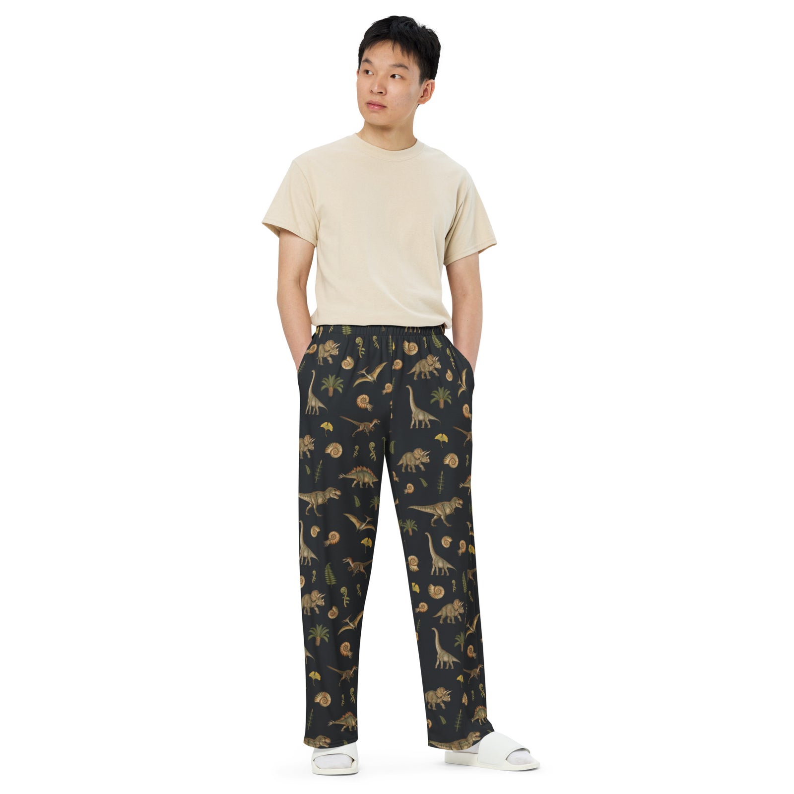 Model wearing Museum Dinosaurs adult dinosaur pajama pants, front view