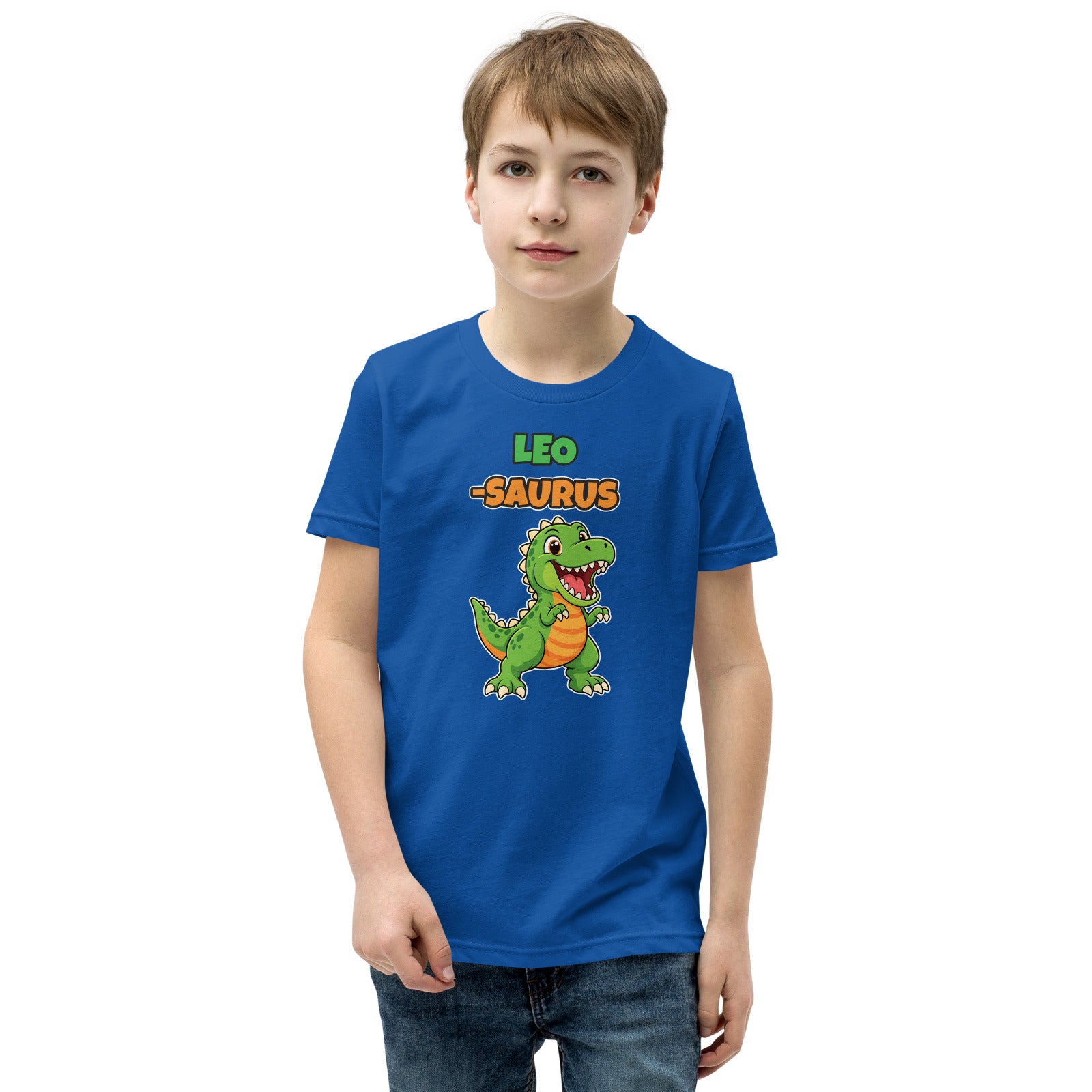 Name-Saurus personalized kids dinosaur t-shirt in True Royal, green cartoon T-rex under the name LEO and the word SAURUS, worn by a child, front view