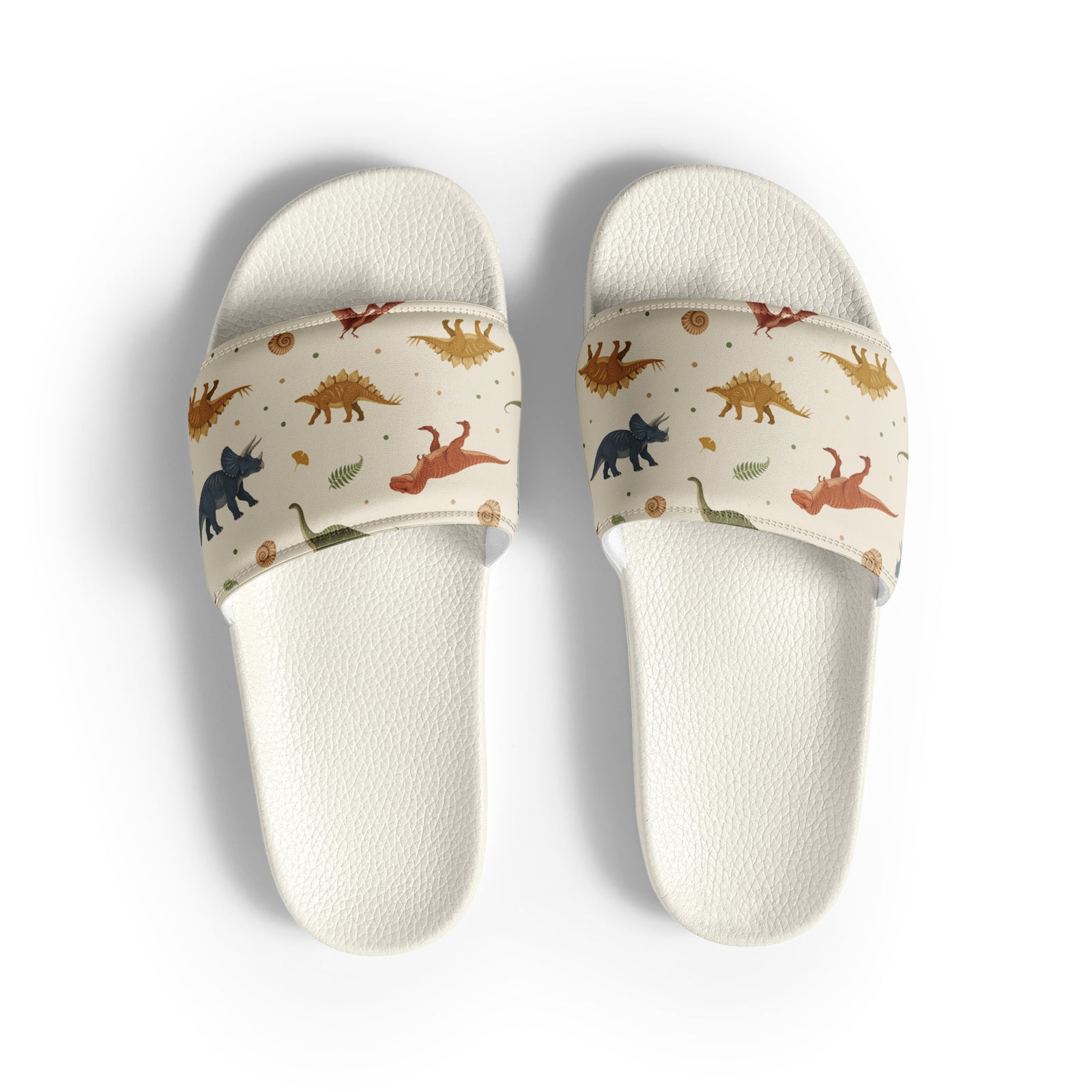 Fossil Botanica men's dinosaur slides with white soles, earthy dinosaur and fern print on a cream strap