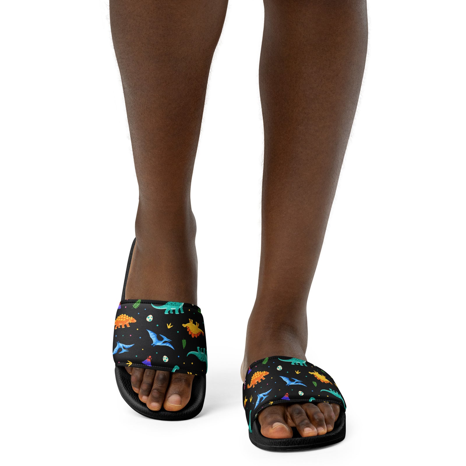 Woman wearing Bright Dinos dinosaur slides with a bright dinosaur pattern strap