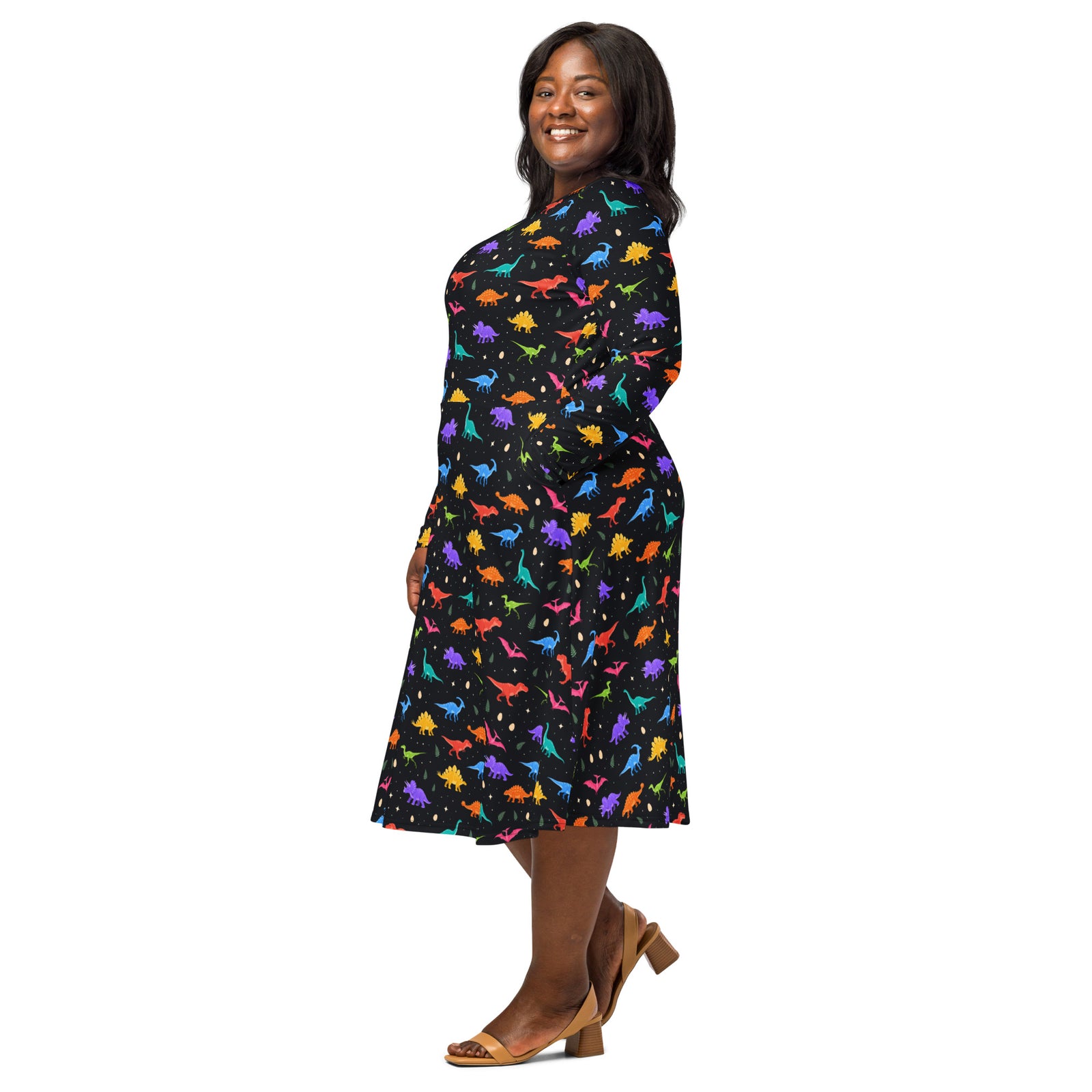 Long sleeve dinosaur dress, side view showing the flared midi skirt and dinosaur print sleeves