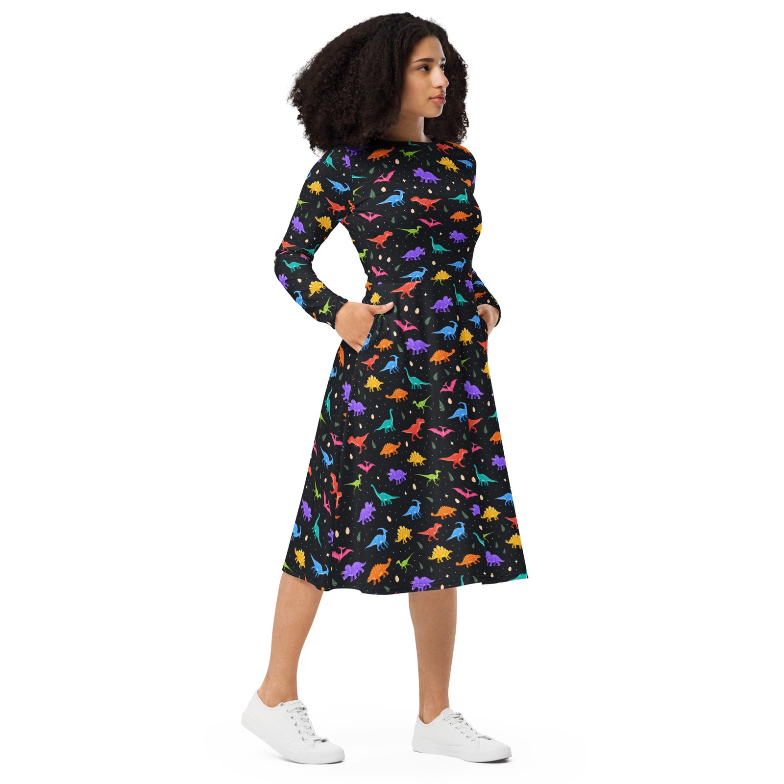 Midnight Dinos women's long sleeve dinosaur dress, front view: colorful T-rex, triceratops and stegosaurus on a black midi dress