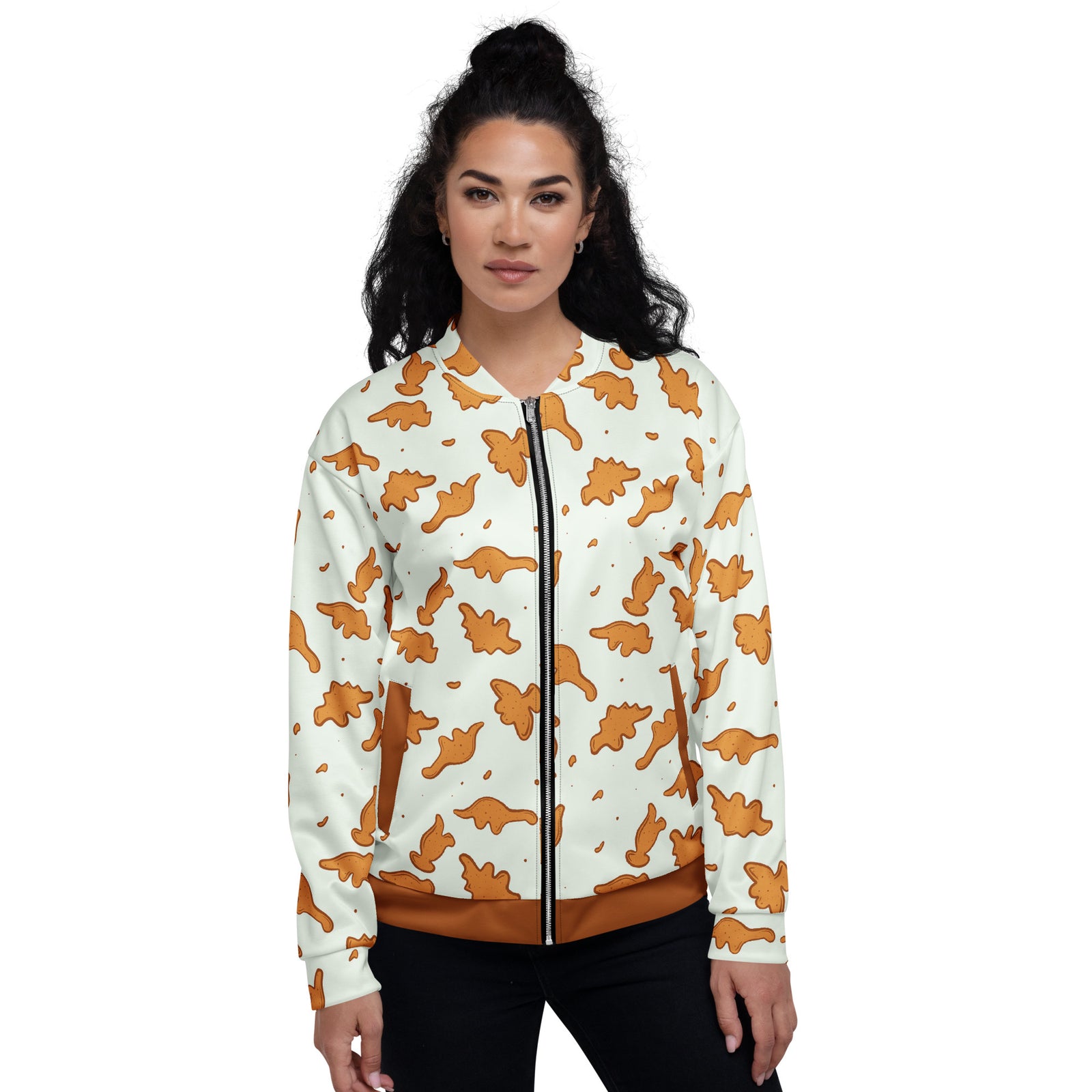 Woman wearing the Dino Nuggies dinosaur jacket with a nugget-brown waistband