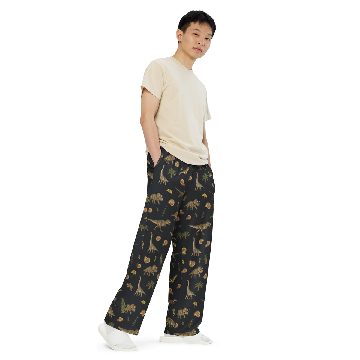 Model wearing Museum Dinosaurs adult dinosaur pajama pants, side view