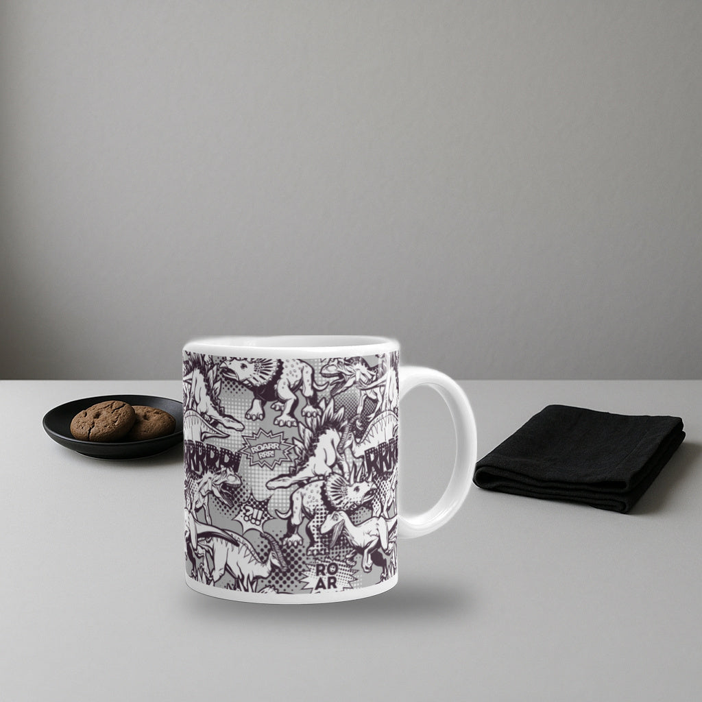 Comic Dinos black and white dinosaur mug on a white studio tabletop with cookies and a black napkin