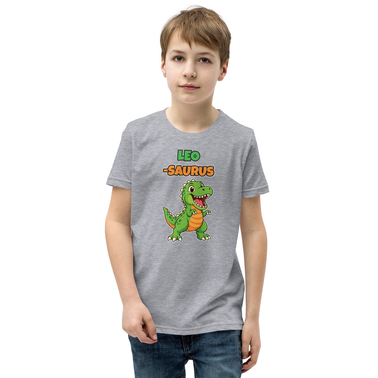 Name-Saurus personalized kids dinosaur t-shirt in Athletic Heather, green cartoon T-rex under the name LEO and the word SAURUS, worn by a child, front view