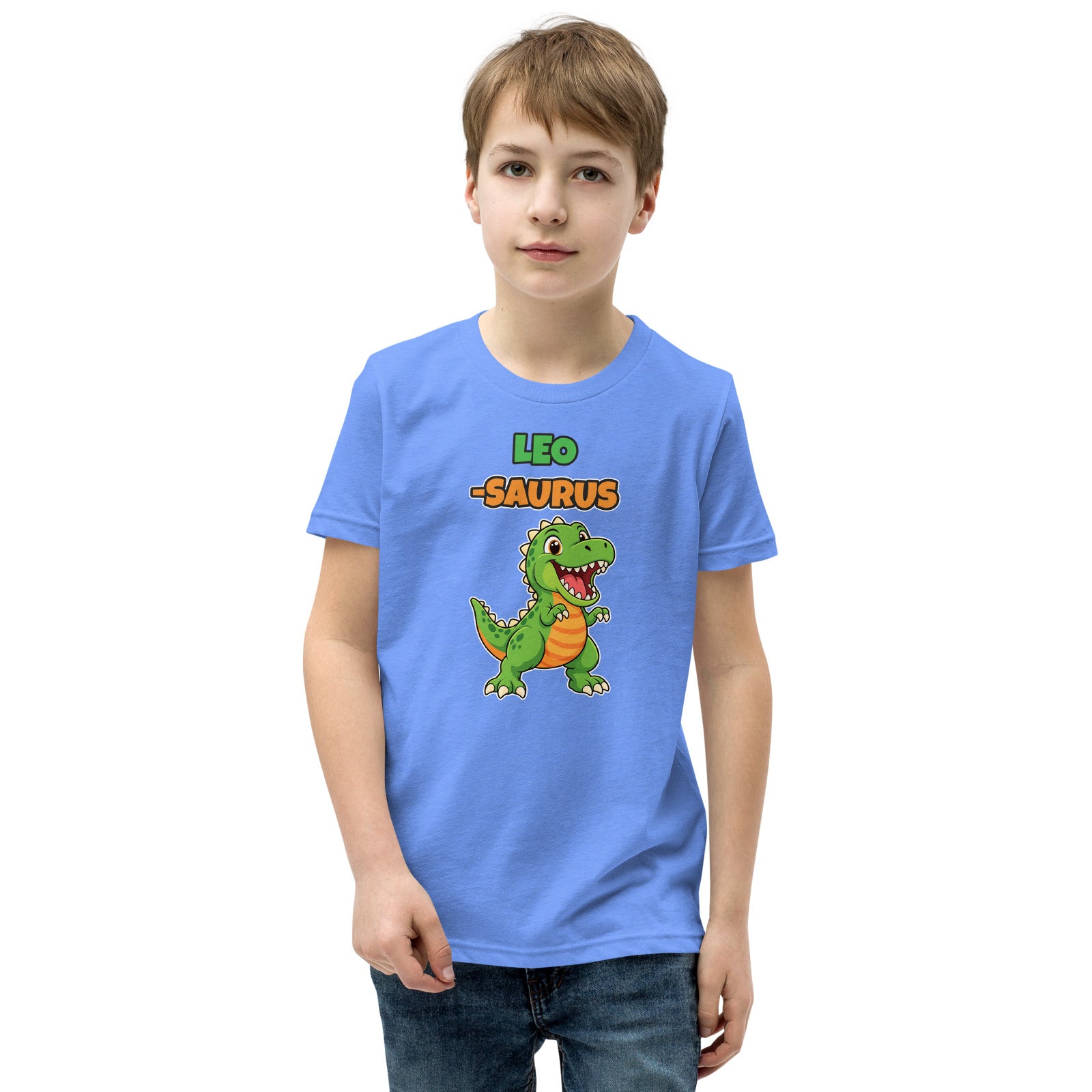 Name-Saurus personalized kids dinosaur t-shirt in Heather Columbia Blue, green cartoon T-rex under the name LEO and the word SAURUS, worn by a child, front view