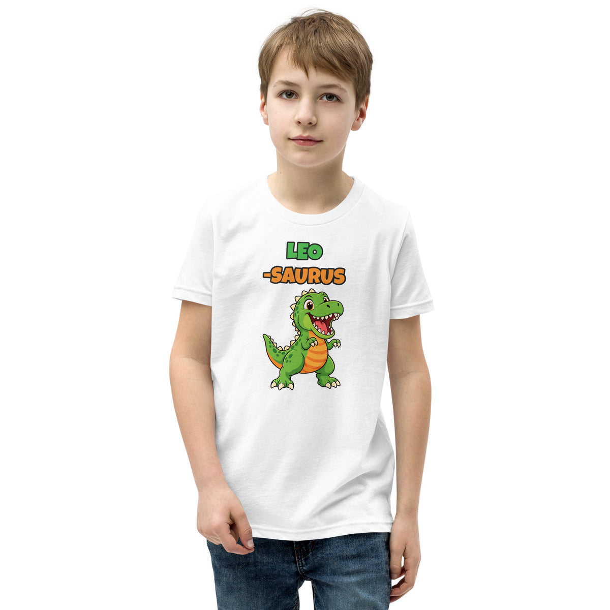 Name-Saurus personalized kids dinosaur t-shirt in White, green cartoon T-rex under the name LEO and the word SAURUS, worn by a child, front view