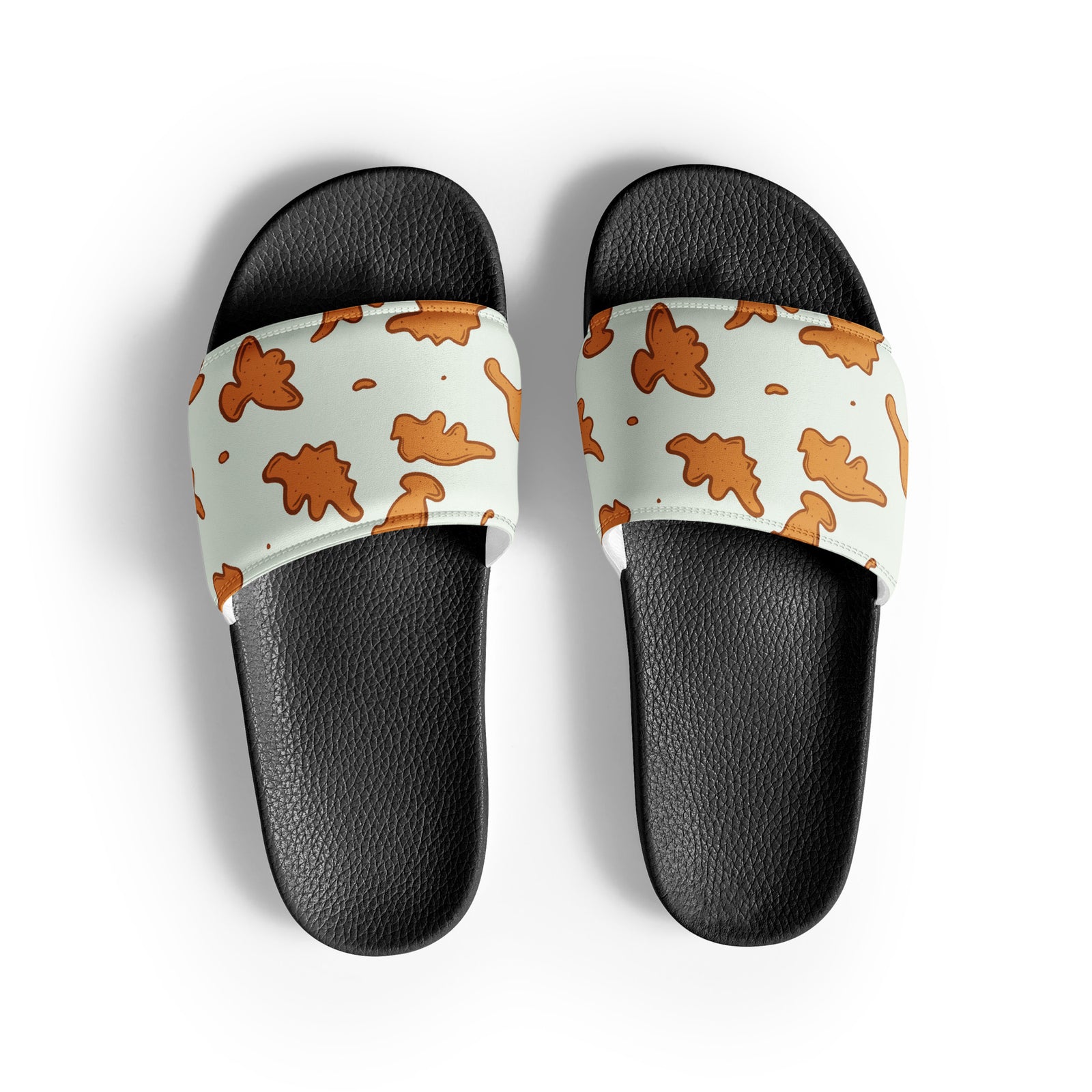 Dino Nuggies men's dinosaur slides with white soles, golden dino nugget print on a light mint strap