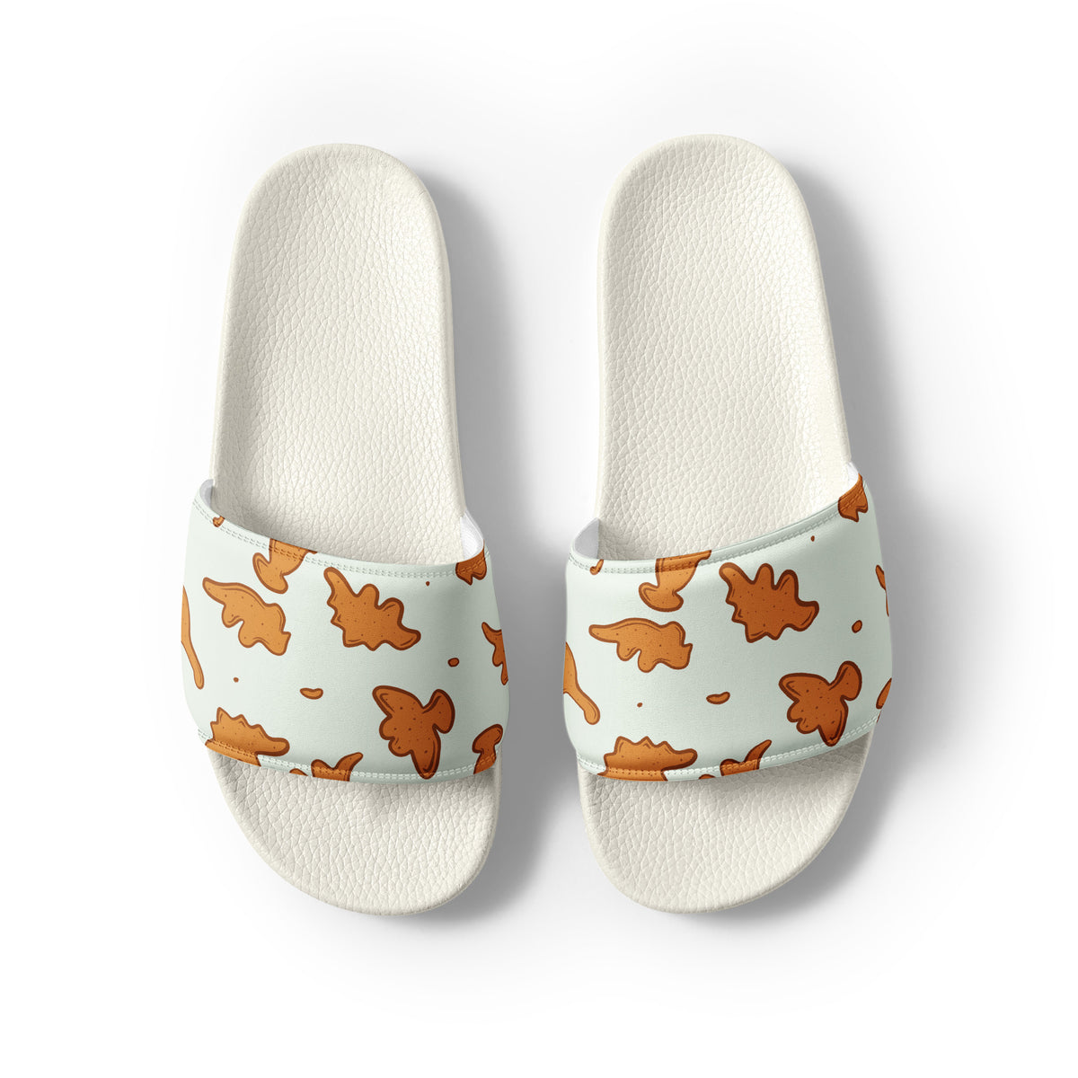 Dino Nuggies men's dinosaur slides with white soles, golden dino nugget print on a light mint strap