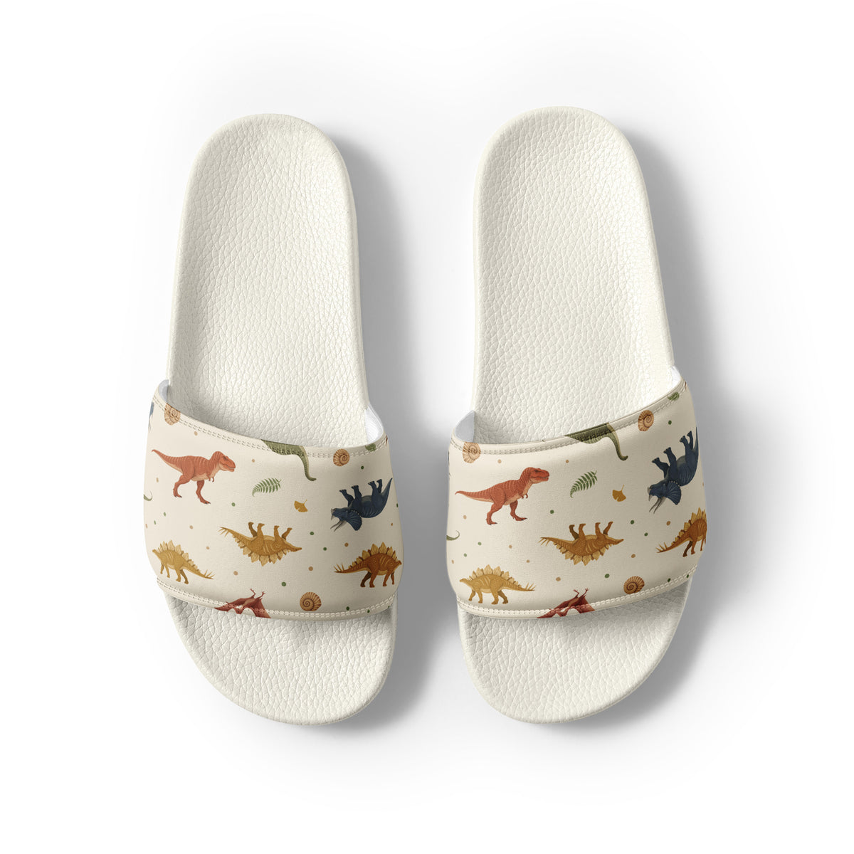 Fossil Botanica men's dinosaur slides with white soles, earthy dinosaur and fern print on a cream strap