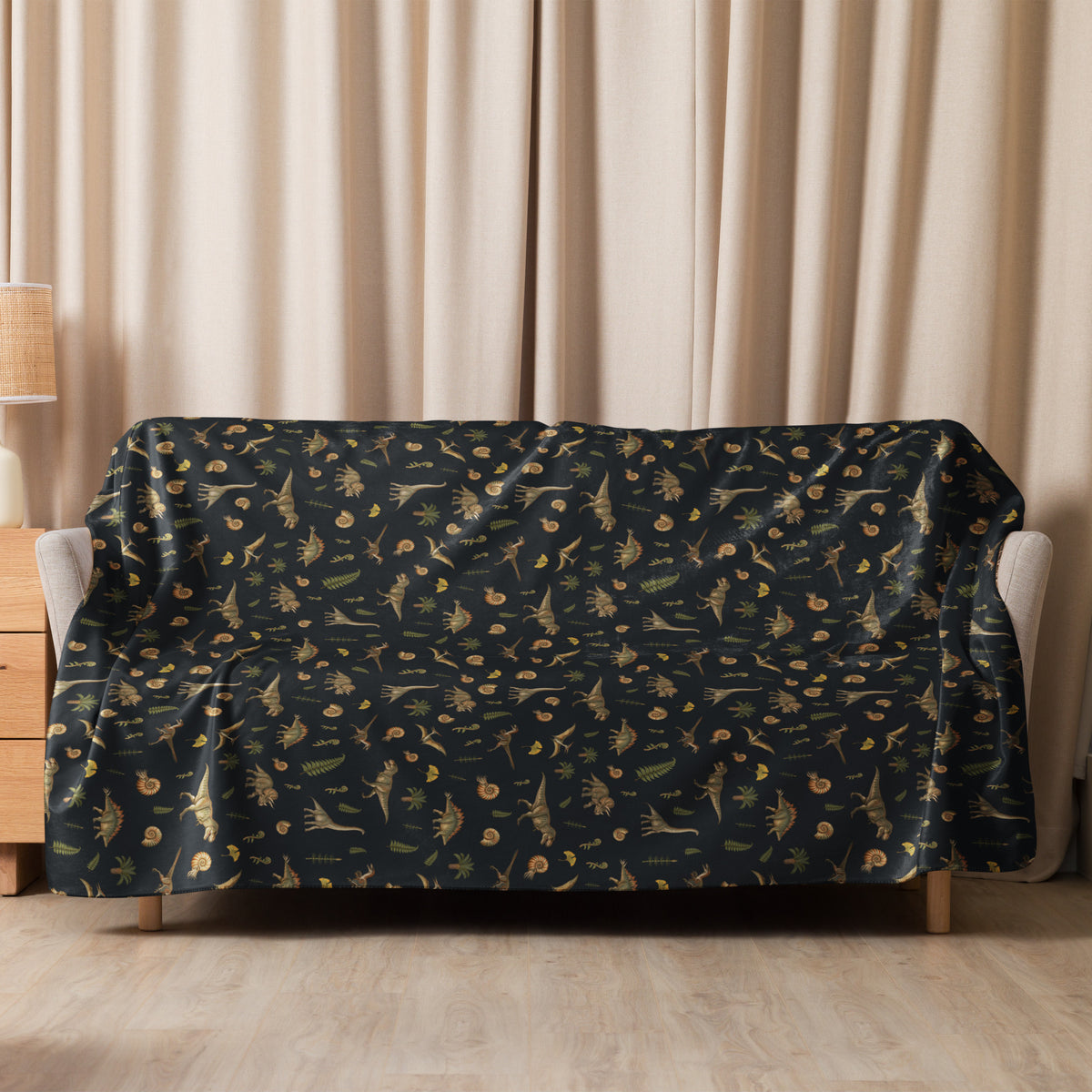 Museum Dinosaurs sherpa dinosaur blanket on a couch - 60x80