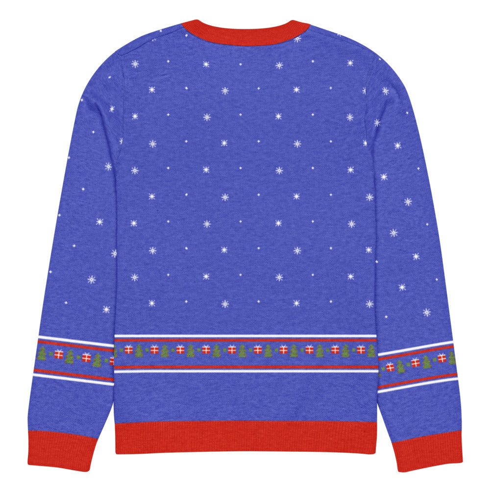 Back of the royal blue Wrap Rex knitted Christmas sweater with snowflakes and a fair-isle band of presents and Christmas trees above the red hem