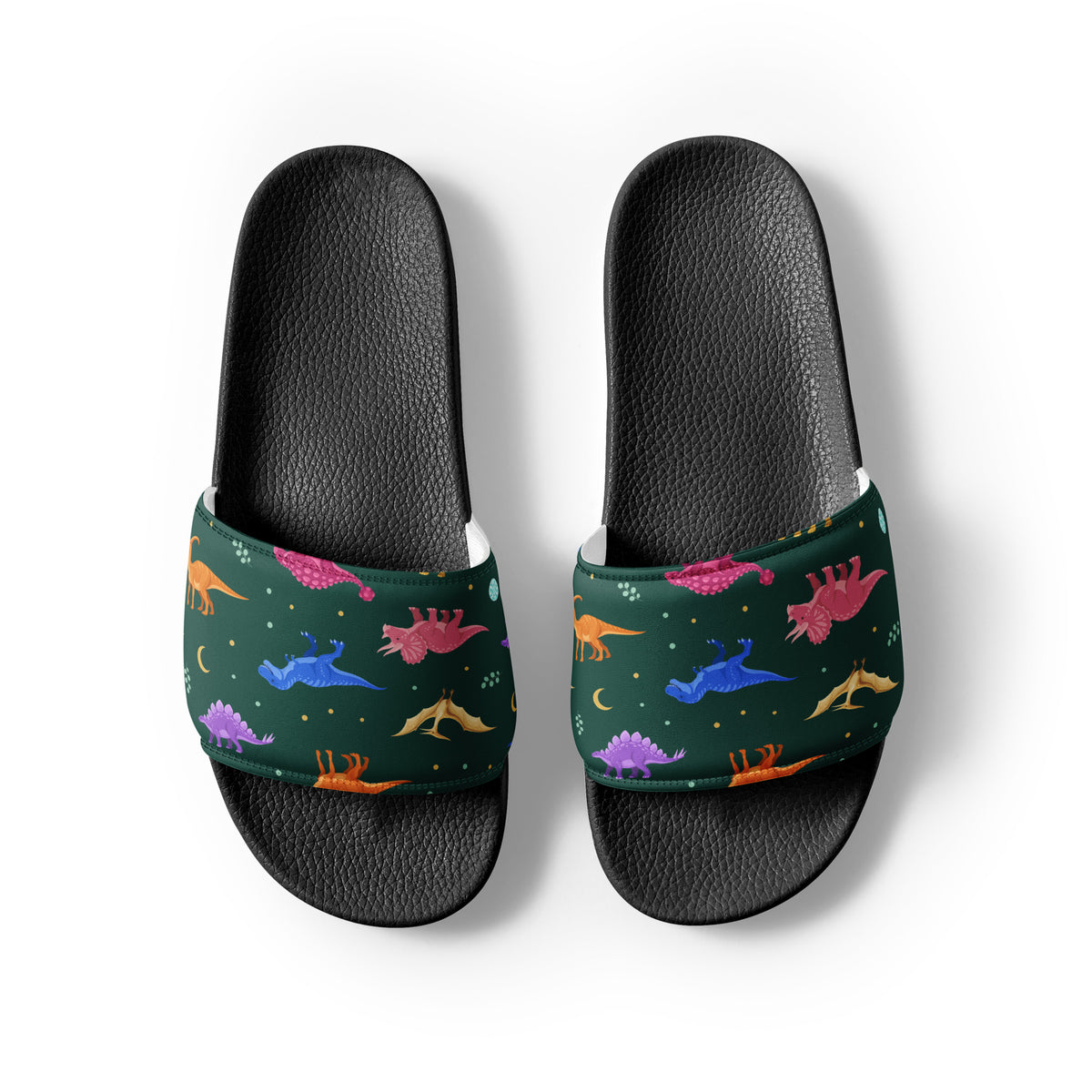 Emerald Jewel Dinos dinosaur slides with black soles, colorful dinosaurs and gold moons on an emerald strap