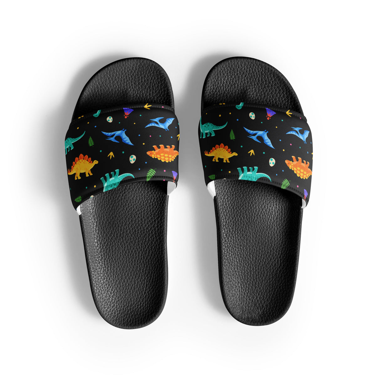 Bright Dinos dinosaur slides with black soles, T-Rex, triceratops and stegosaurus print on a black strap