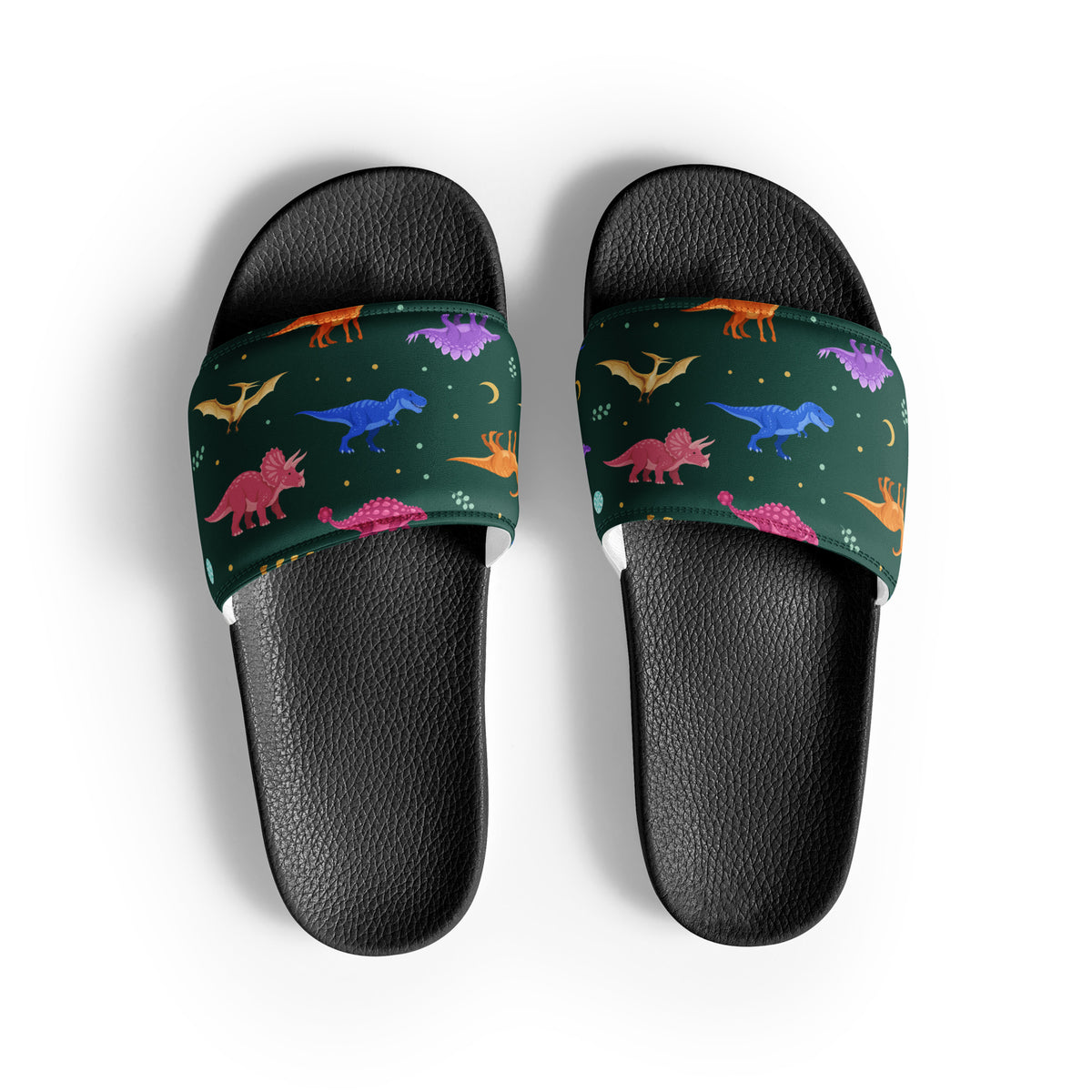Emerald Jewel Dinos dinosaur slides with black soles, colorful dinosaurs and gold moons on an emerald strap