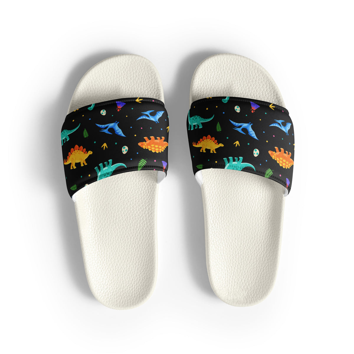 Bright Dinos women's dinosaur slides with white soles, colorful cartoon dinosaurs printed on a black strap