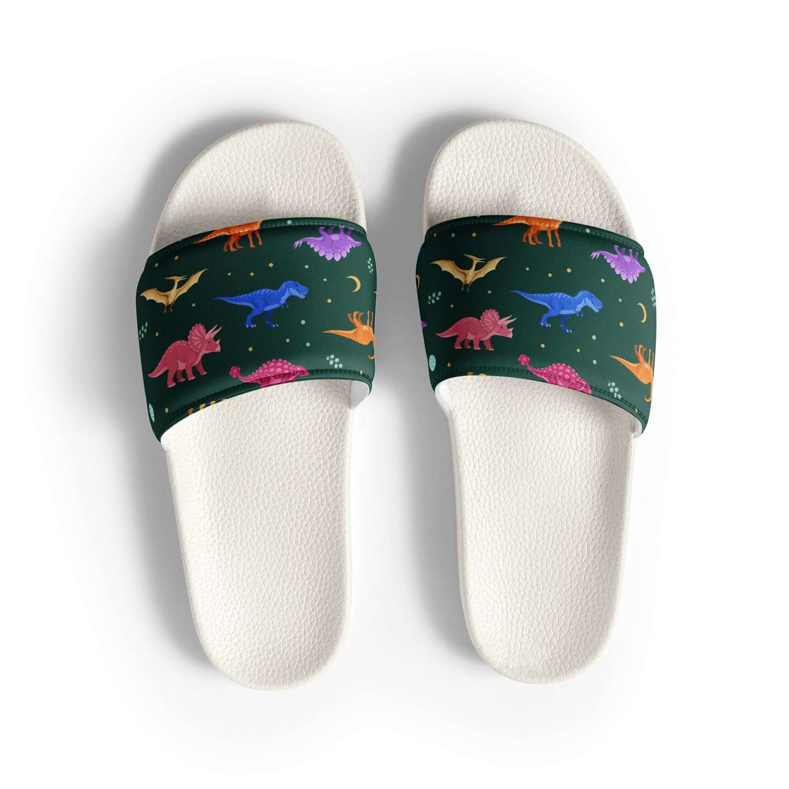 Emerald Jewel Dinos women's dinosaur slides with white soles, jewel-toned dinosaurs on a deep green strap