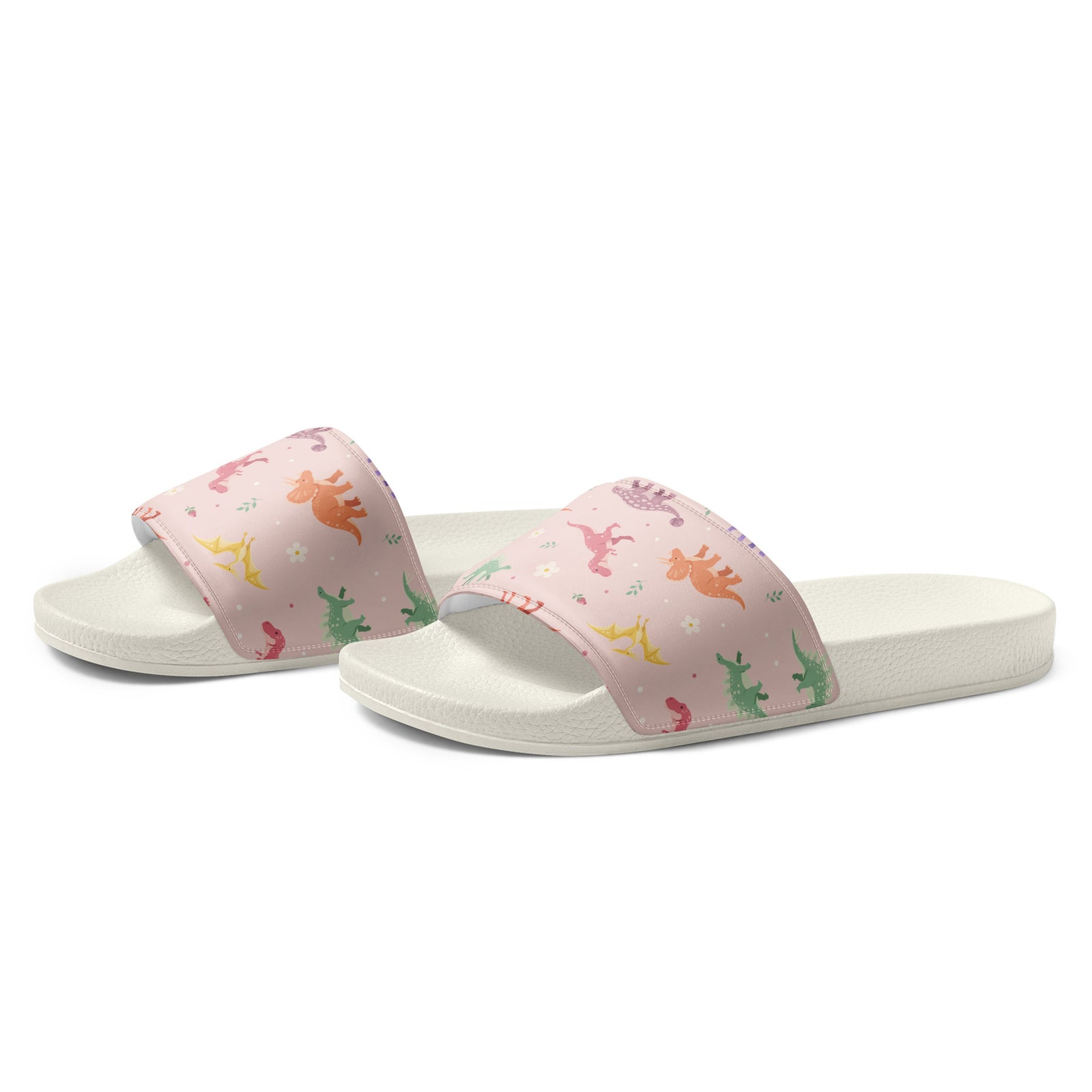 Angled view of Blush Bloom Dinos dinosaur slides showing the cushioned printed strap