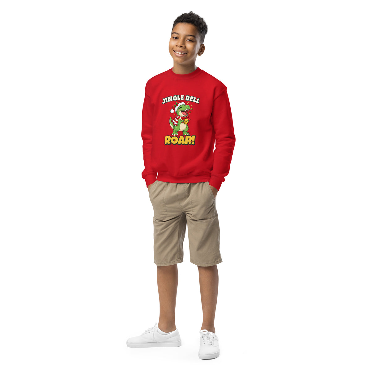 Kid wearing the Jingle Bell Roar dinosaur Christmas sweatshirt with a singing T-rex in a Santa hat