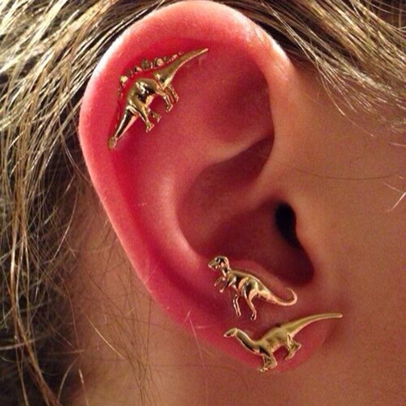 Dinosaur studded earrings